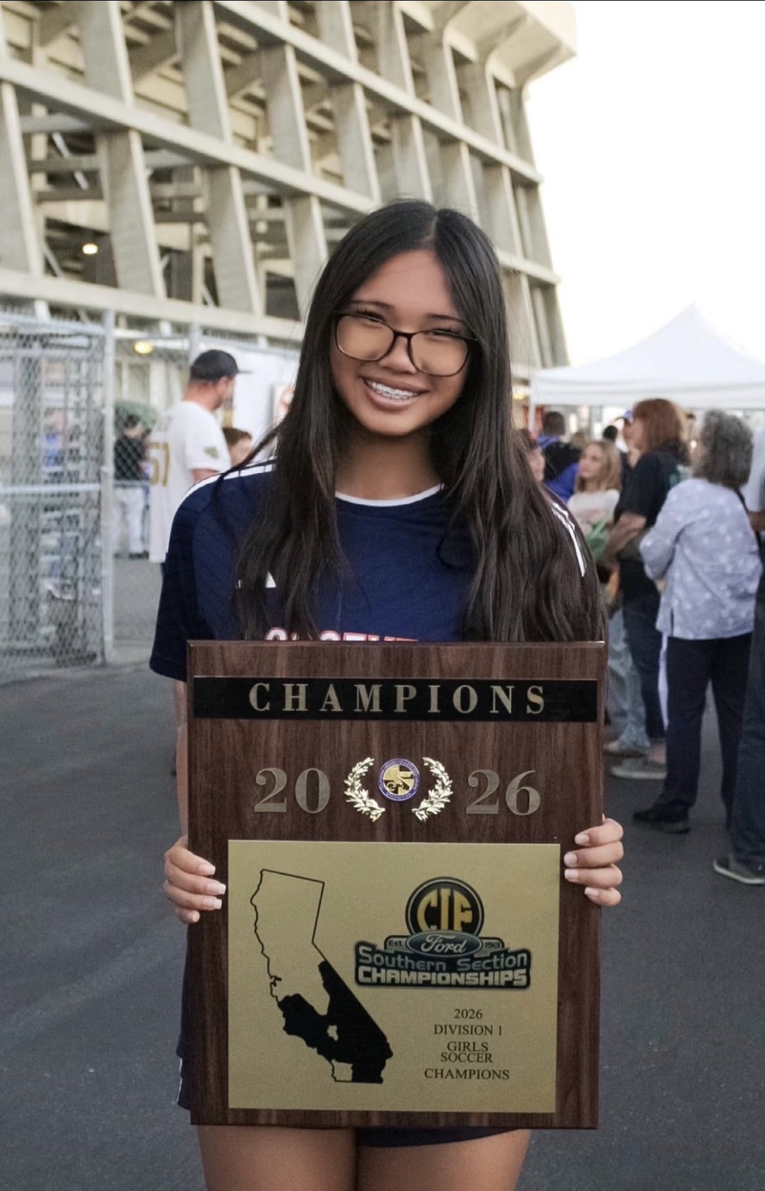 With the plaque: 2026 CIF Southern Section Division 1 champions