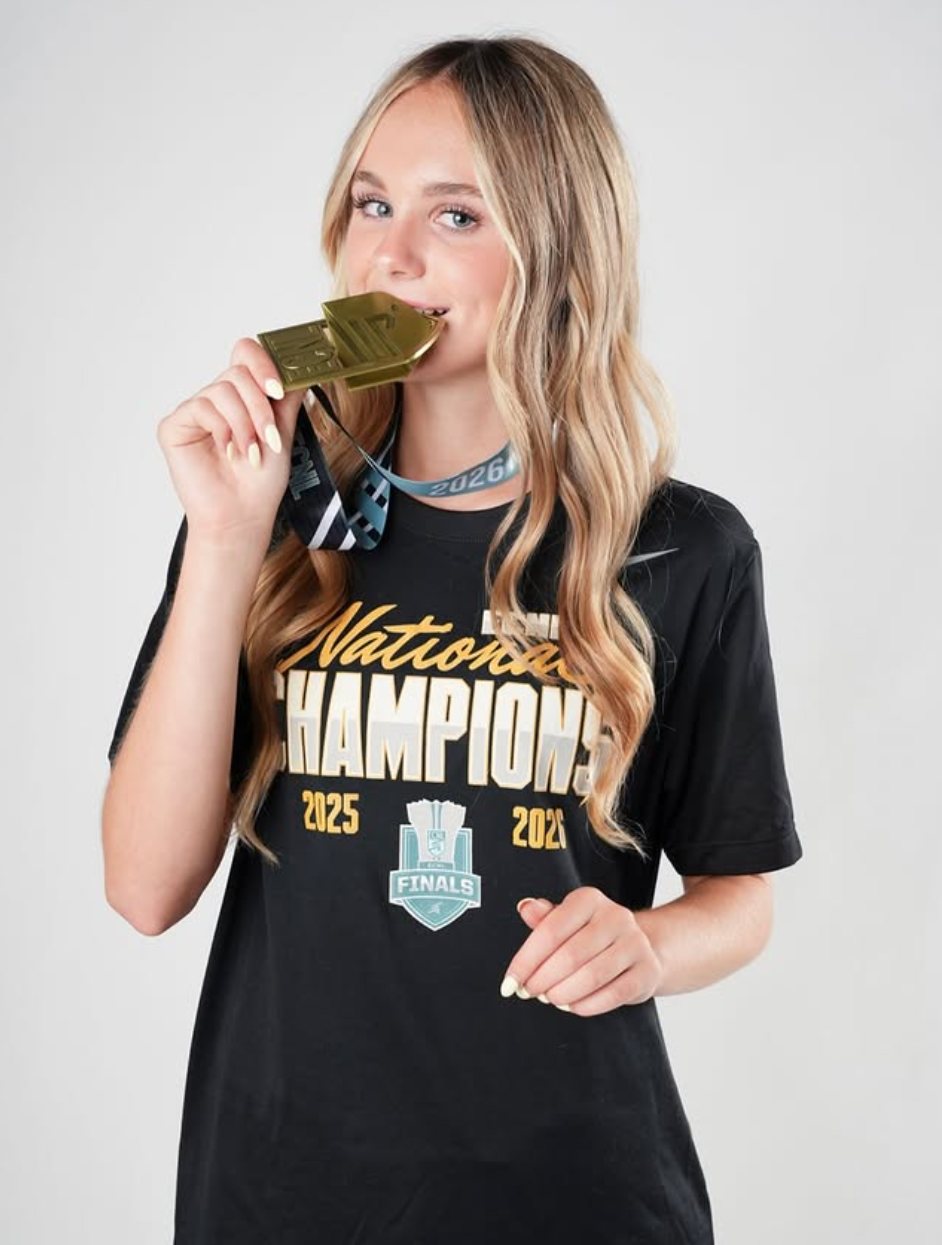 Studio portrait with the medal, 2026
