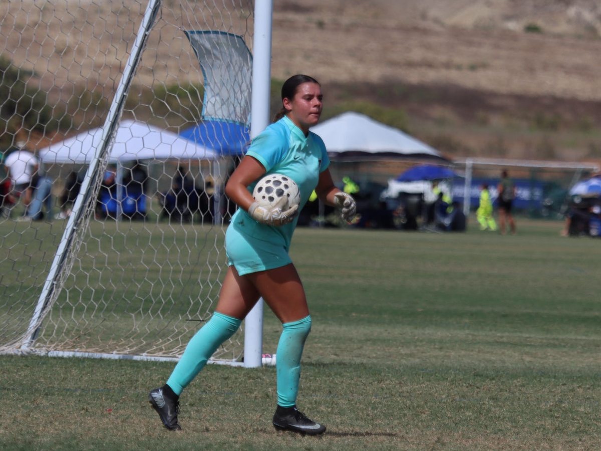Naiomi Tase, ball in hand, ready to restart
