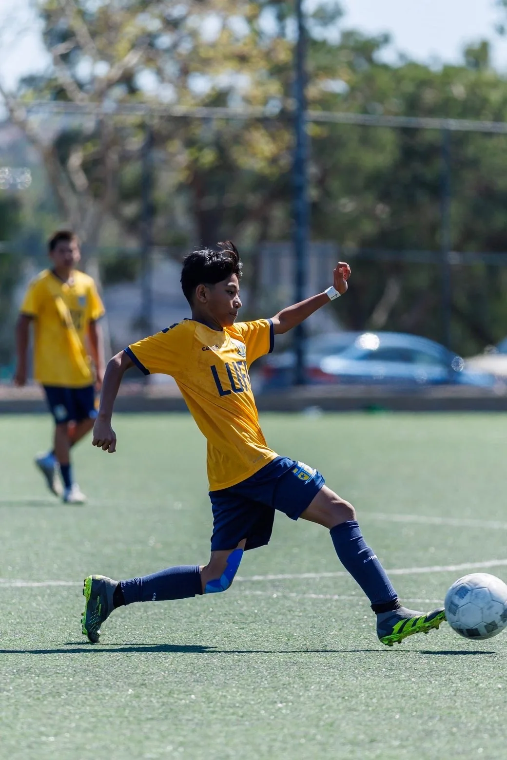 Striking through the ball.