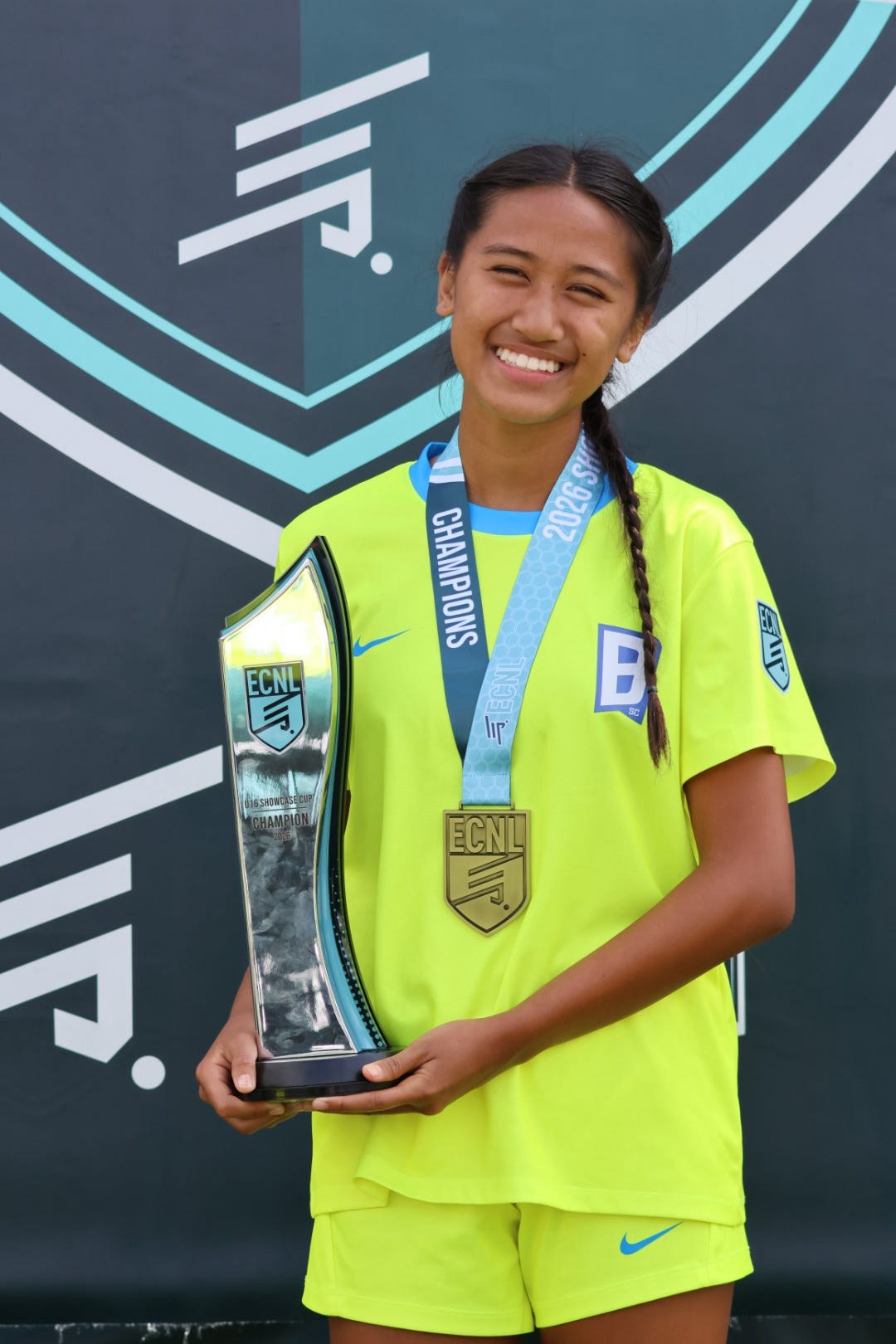 With the trophy and her medal: 2026 ECNL U16 Showcase Cup Champion